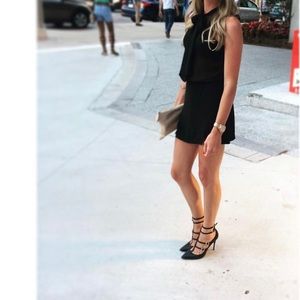 Sheer black sleeveless tie neck blouse